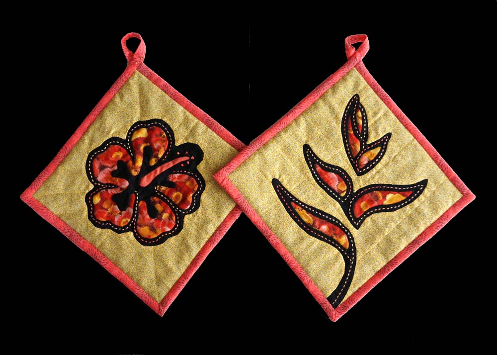 Potholders with mola and sashiko hibiscus and heliconia flowers